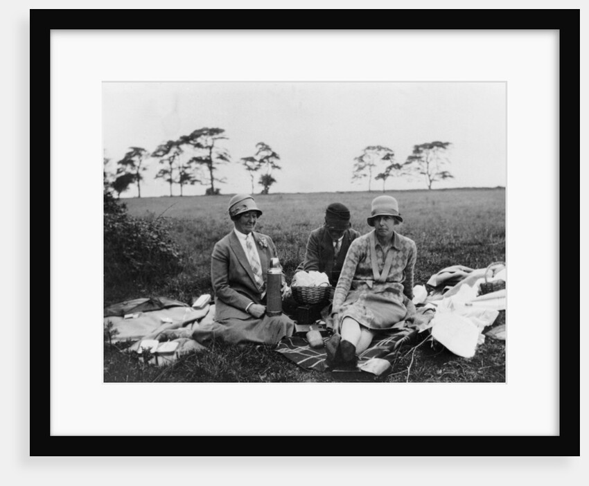 Three women having a picnic in a field, (1920s?) by Unknown