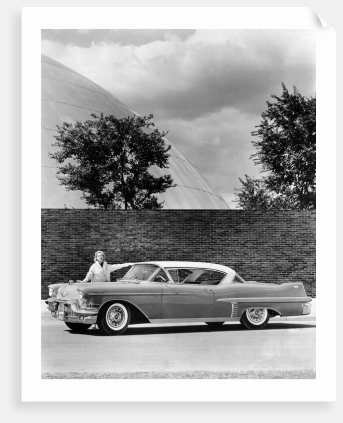 Woman with a 1957 Cadillac coupe de ville by Anonymous