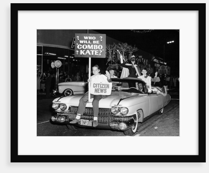 Fancy dress parade with a 1957 Cadillac, USA, (c1957?) by Unknown