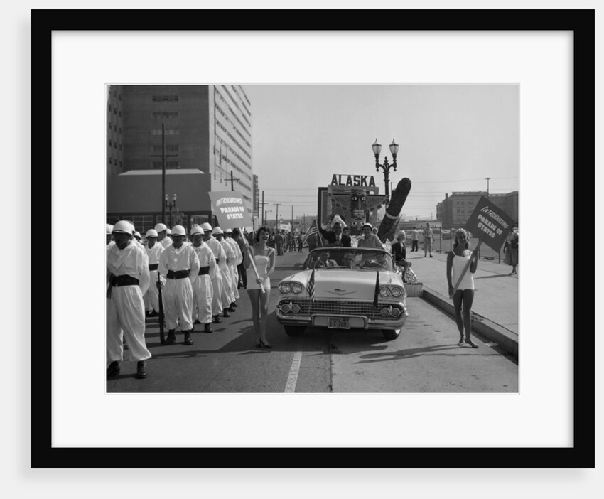 Models and a Cadillac on a parade, USA, (c1959?) by Unknown