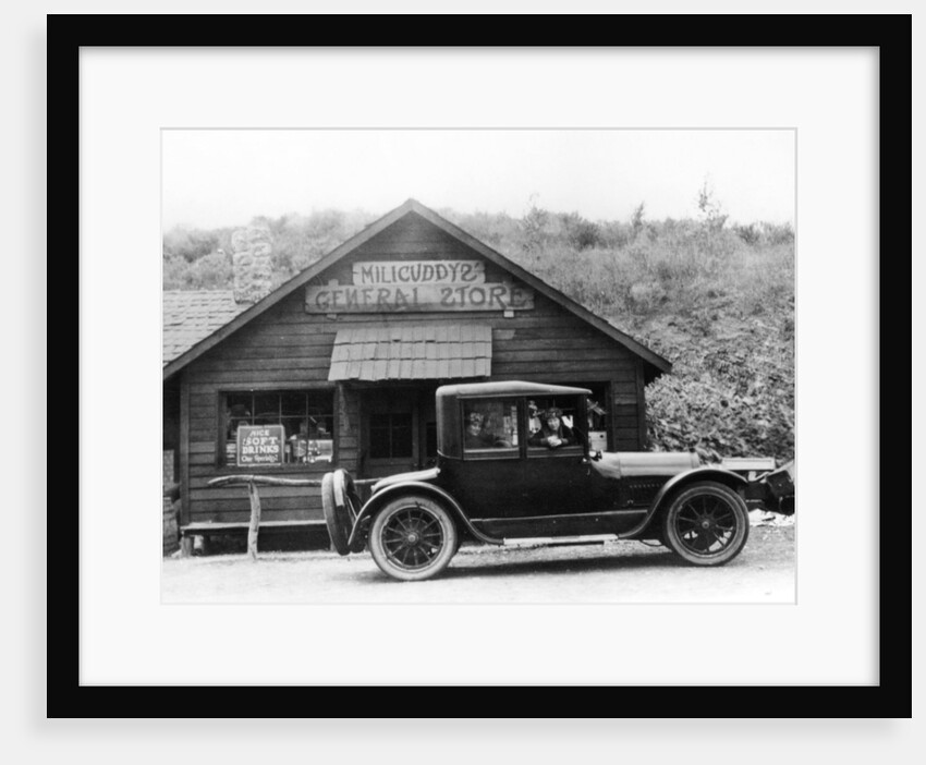 1916 Cadillac V8 car, parked outside a general store, USA by Anonymous