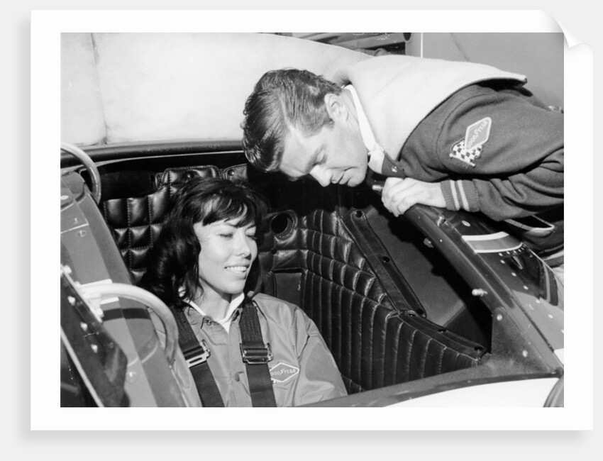 Craig Breedlove explaining the controls of 'Spirit of America Sonic I' to his wife, Lee, c1965 by Unknown