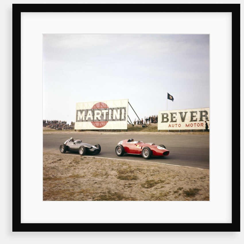 Two racing cars taking a bend by Anonymous