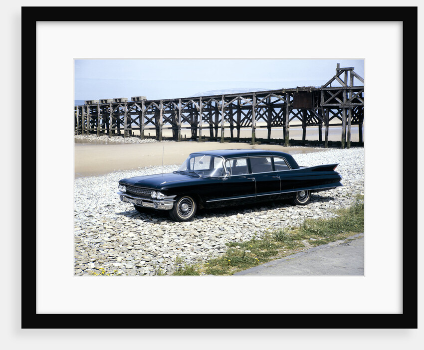 A 1961 Cadillac Presidential limousine on a beach by Unknown