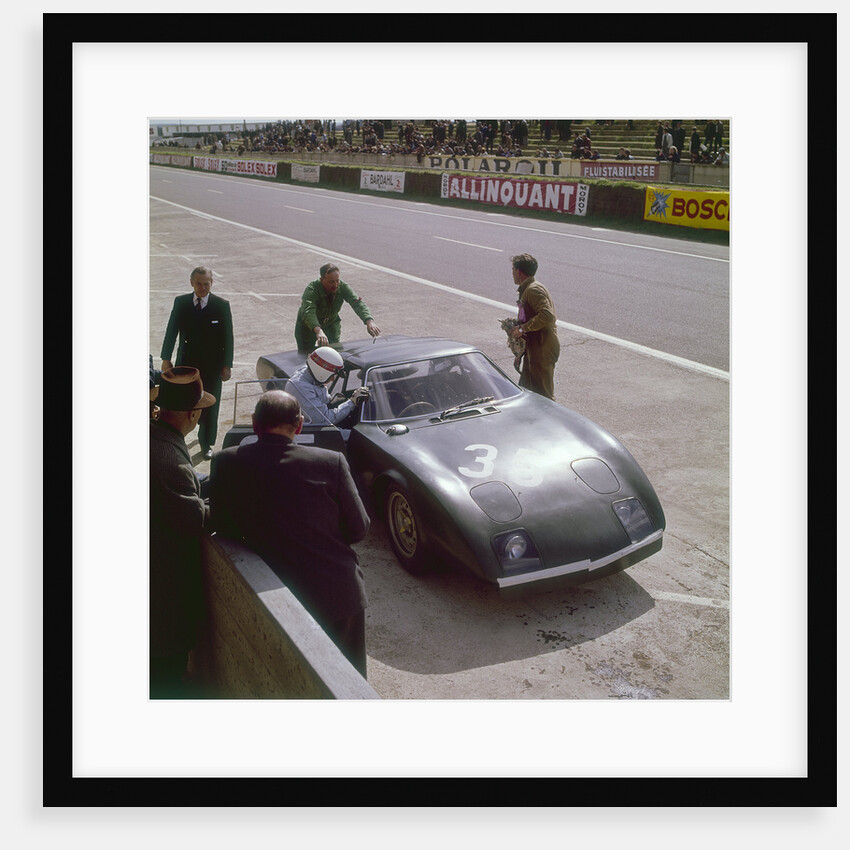 Jackie Stewart getting into a Rover BRM turbine by Anonymous