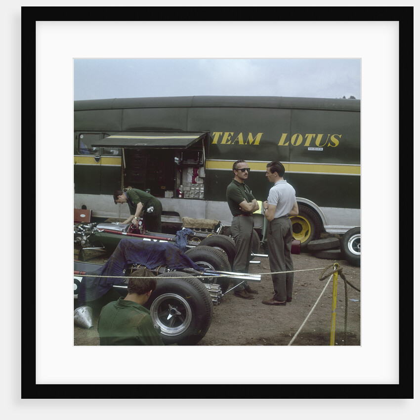 Chapman and Clark outside the Lotus team bus by Anonymous