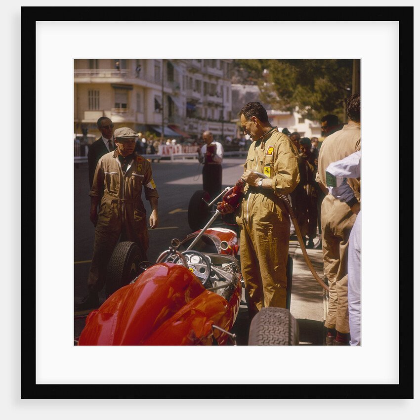 A Ferrari team member filling a car with fuel, Monaco Grand Prix, Monte Carlo, 1963 by Unknown