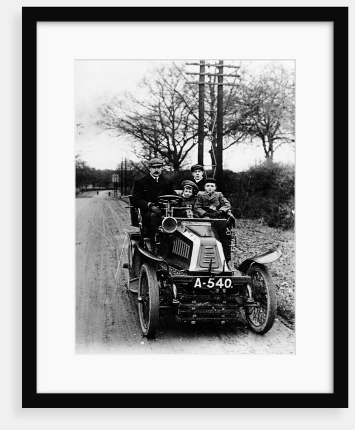 A man and boys in a De Dion car, 1908 by Unknown