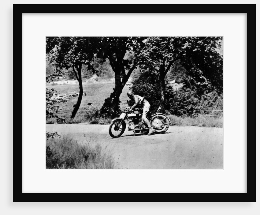 A man on a Norton bike taking part in the Belgian Grand Prix by Anonymous