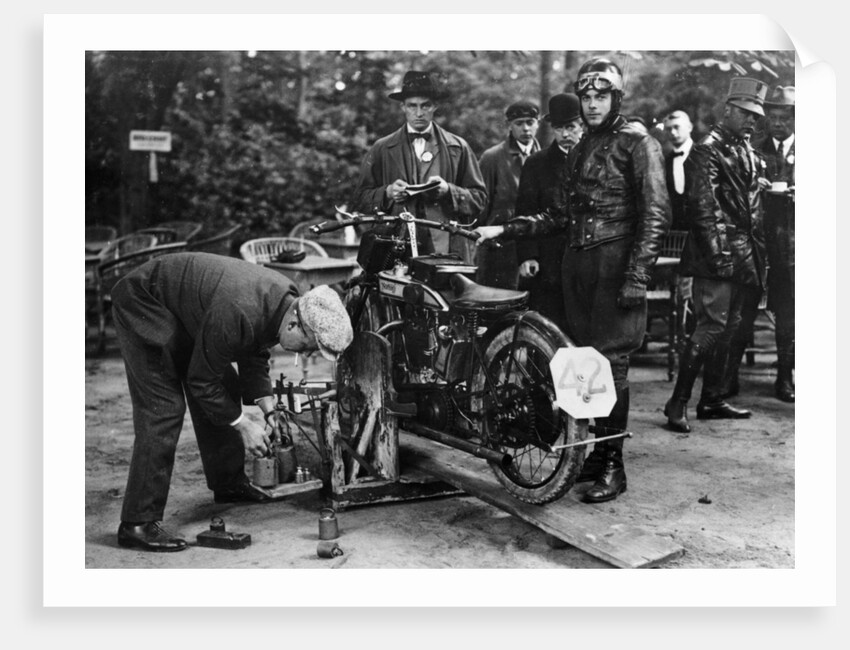 Karl Burlage having his Norton bike weighed for a TT competition by Unknown