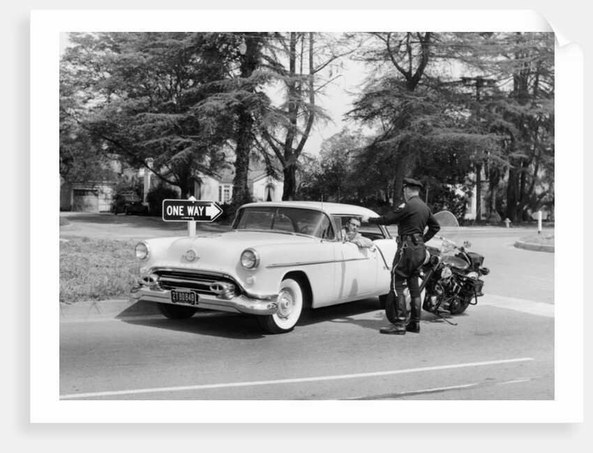 An Oldsmobile at the corner of an American street, 1954 by Unknown