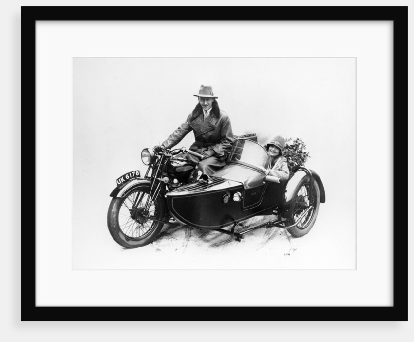 Man riding an AJS motorbike with a woman in the sidecar, 1939 by Unknown