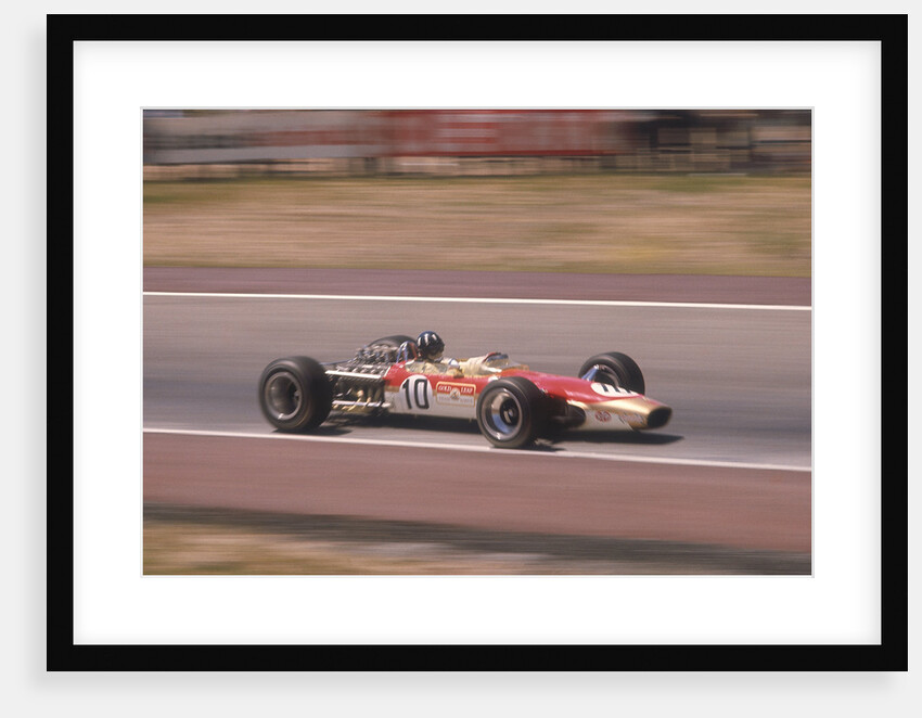 Graham Hill's Lotus at speed by Anonymous