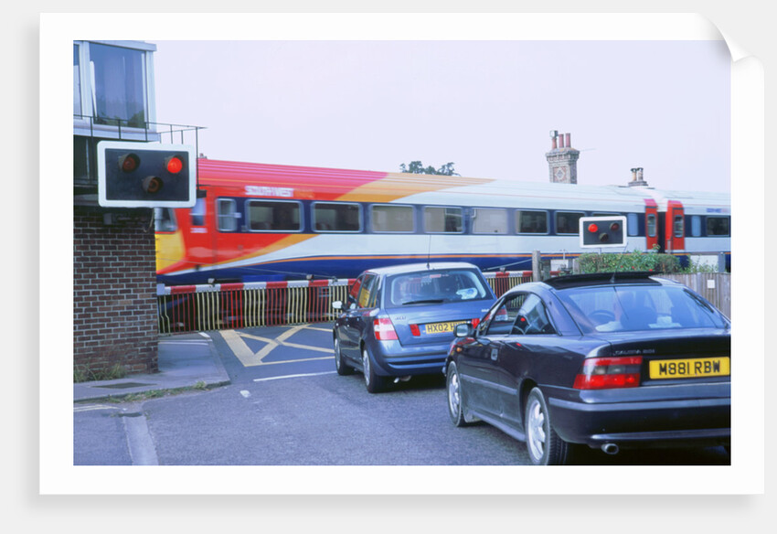 Traffic queue at level crossing in Brockenhurst, Hampshire by Unknown