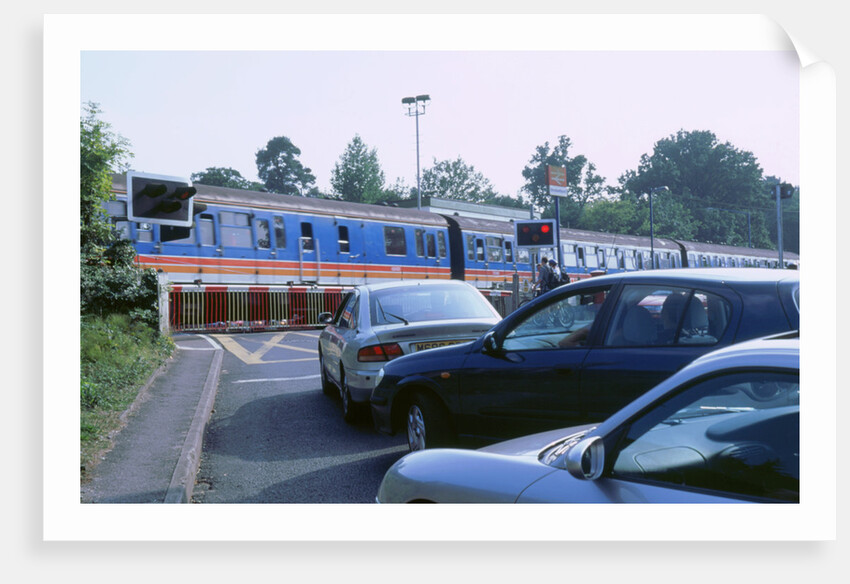 Traffic queue at level crossing in Brockenhurst, Hampshire by Unknown