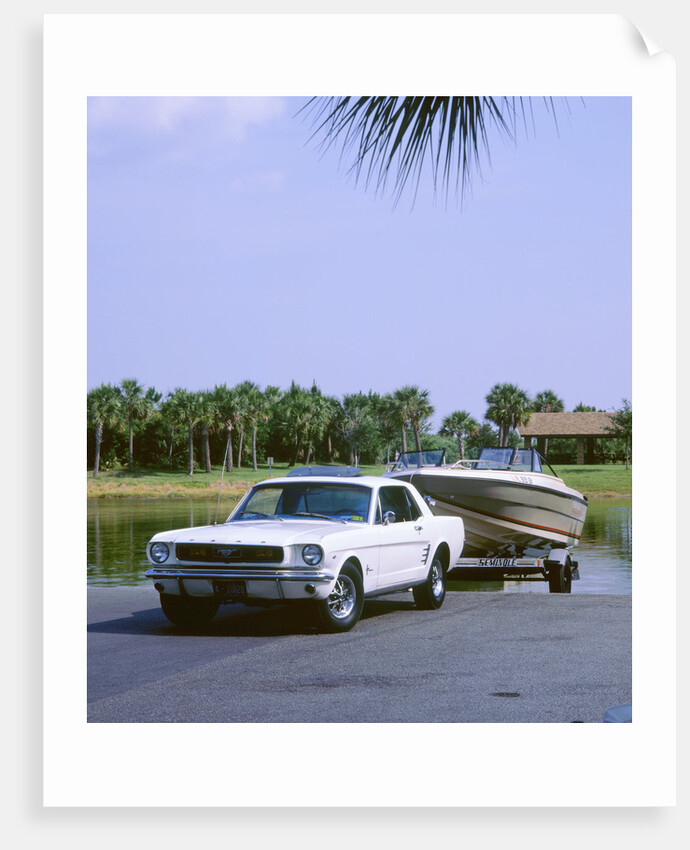 1967 Ford Mustang towing a boat by Unknown