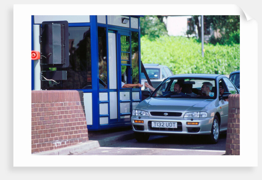 Subaru using toll booth on Itchen bridge, Southampton by Unknown