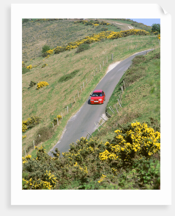 1996 Suzuki Baleno GS Sport on winding country lane,Dorset by Unknown