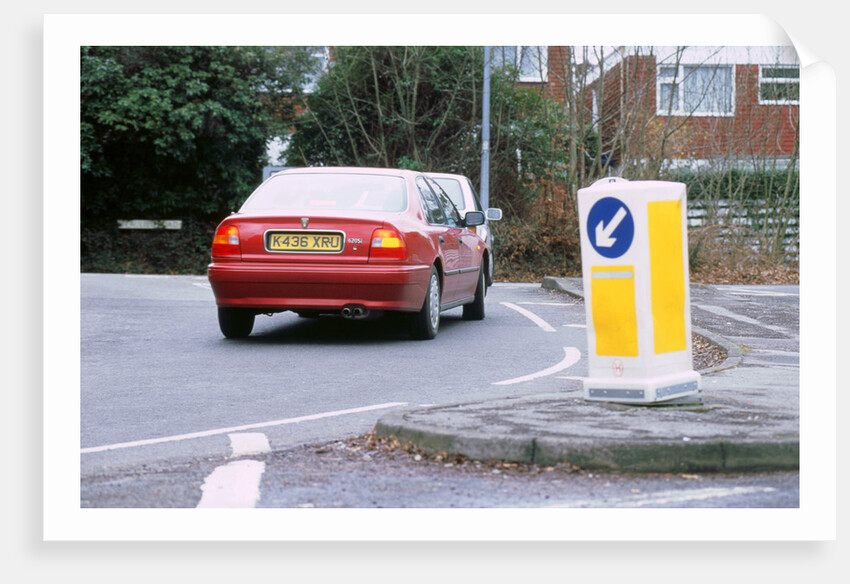 Keep left bollard.Road junction by Unknown