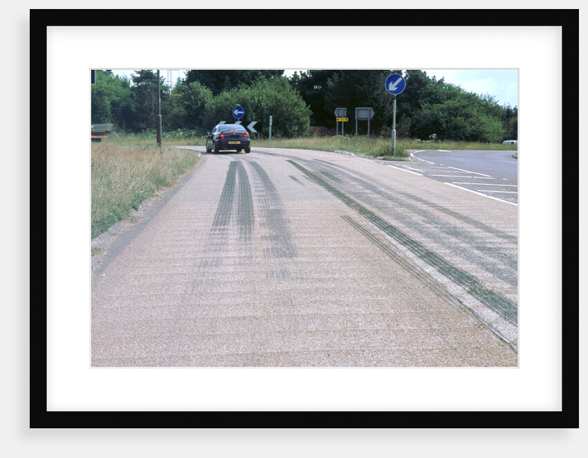 Tyre skidmarks on road surface by Unknown