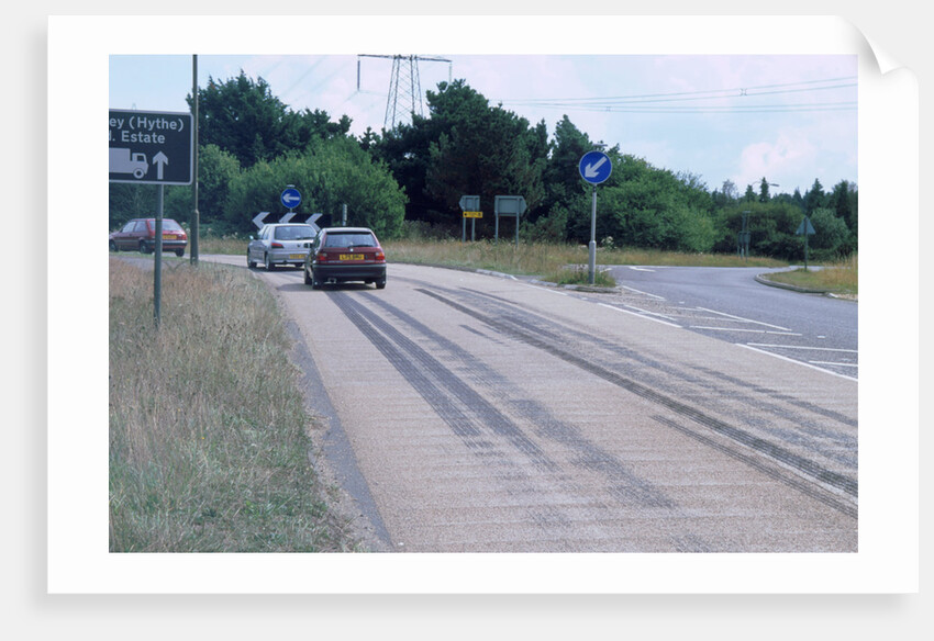Tyre skidmarks on road surface by Unknown