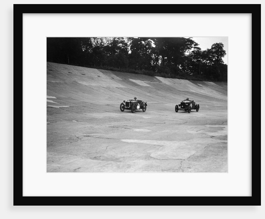Austin Ulster leading a Windsor on the banking at Brooklands by Bill Brunell