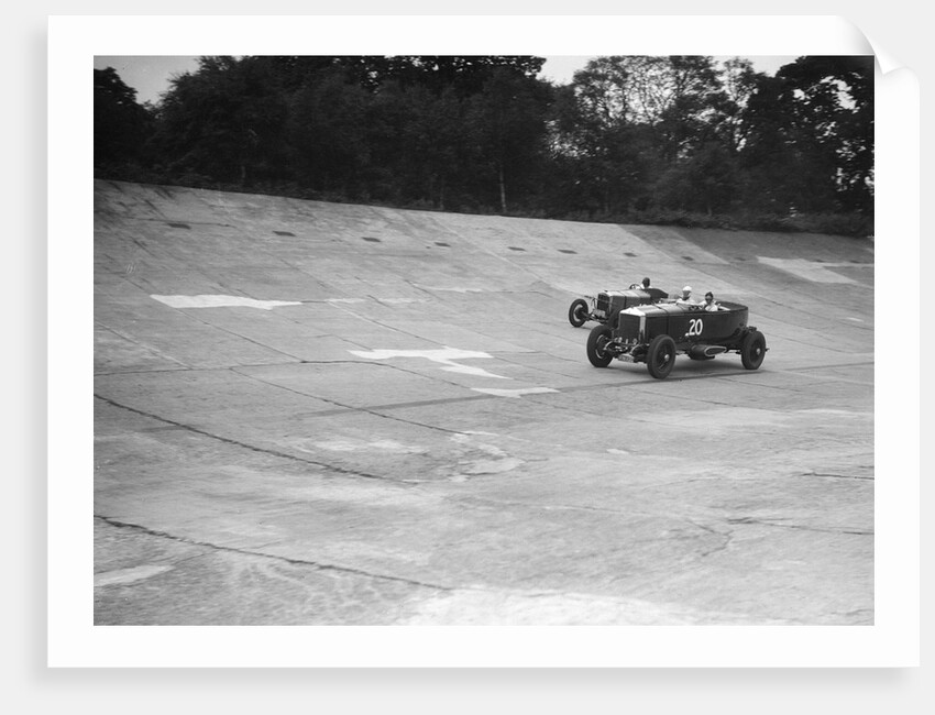 GL Baker's 5954 cc Minerva racing a 1930 Frazer-Nash Sportop on the banking at Brooklands by Bill Brunell
