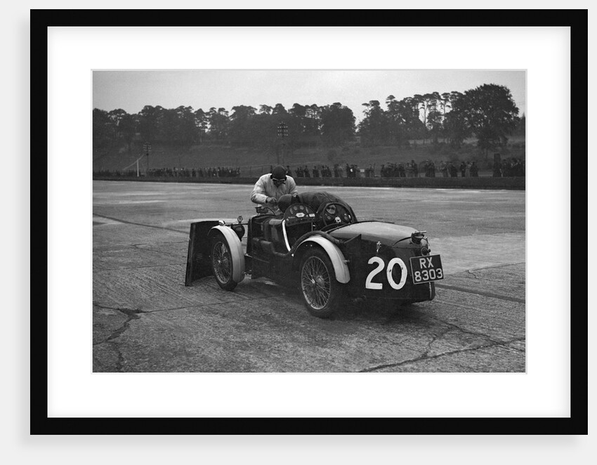 Mechanic making adjustments to a MG C type, Brooklands by Bill Brunell