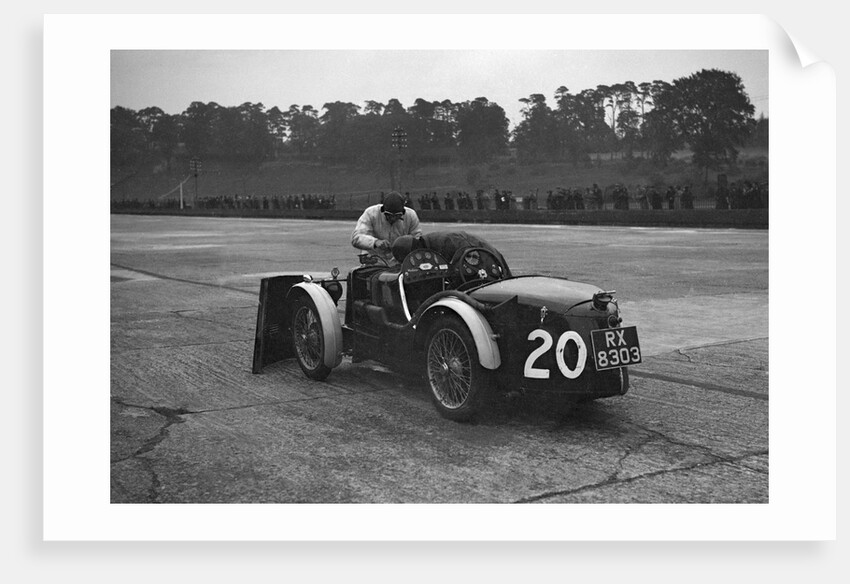 Mechanic making adjustments to a MG C type, Brooklands by Bill Brunell