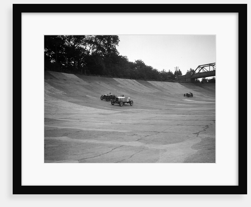 Alvis 17 and Austin 747 cc racing on the banking at Brooklands by Bill Brunell