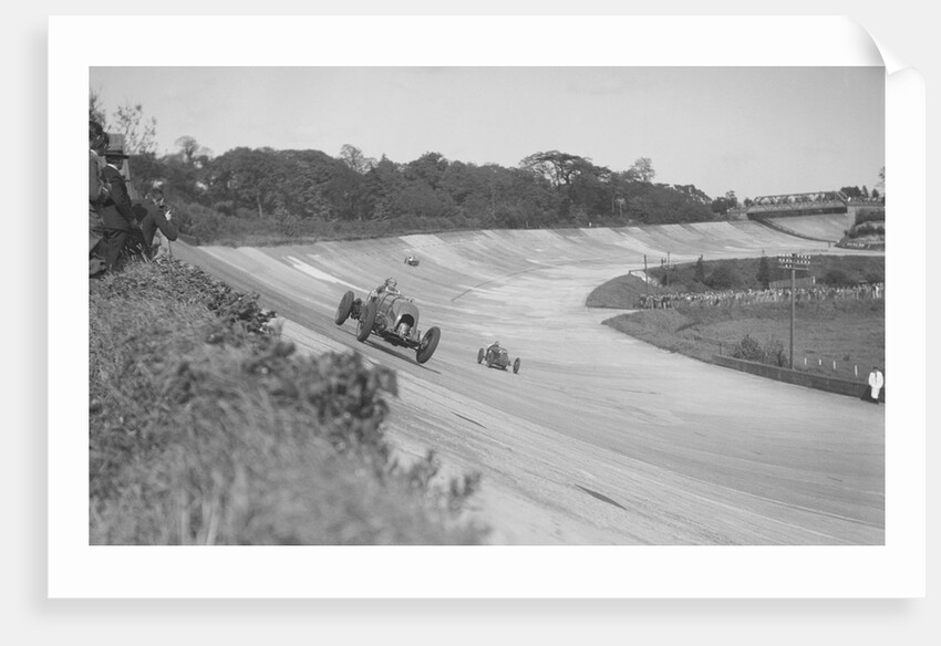 Sir Henry Birkin's Bentley leading Earl Howe's Bugatti Type 54, BARC meeting, Brooklands, May 1932 by Bill Brunell