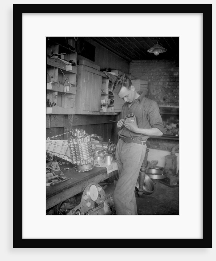 Mechanic working on Raymond Mays' 2996 cc Vauxhall-Villiers by Bill Brunell