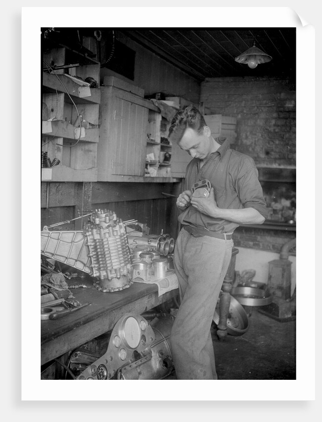 Mechanic working on Raymond Mays' 2996 cc Vauxhall-Villiers by Bill Brunell
