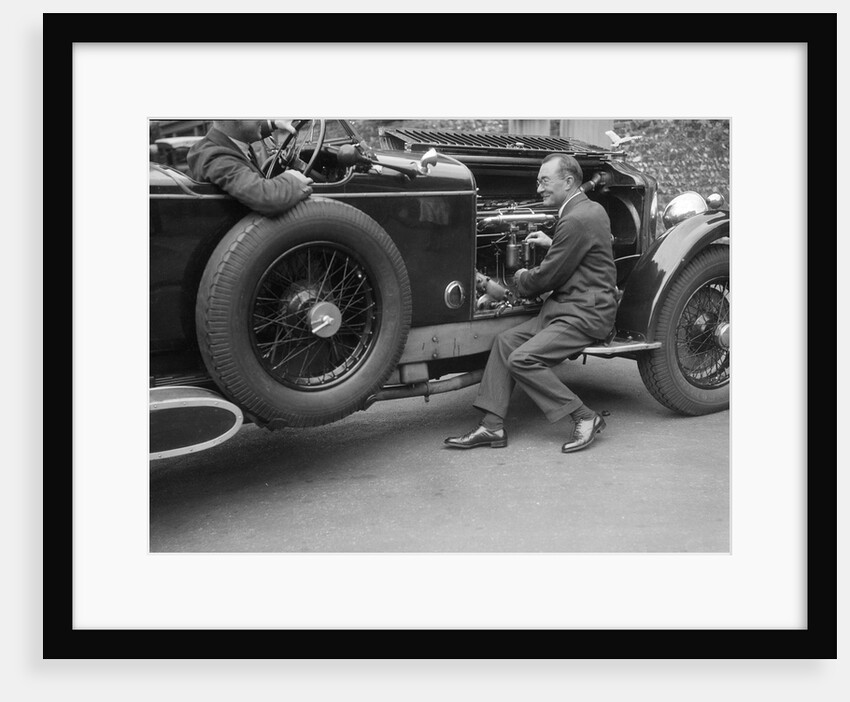 Geoffrey Baker inspecting the engine of a Minerva car by Bill Brunell