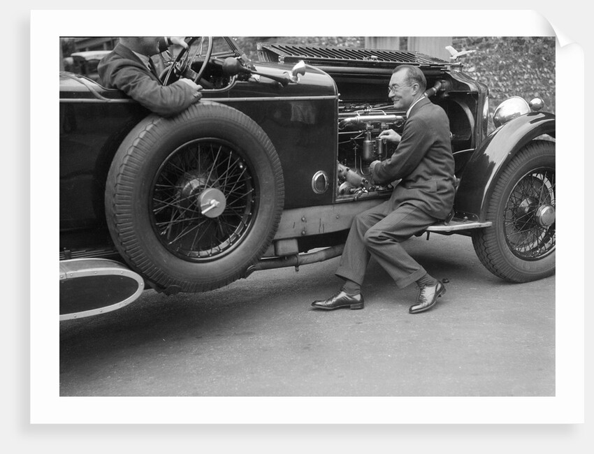 Geoffrey Baker inspecting the engine of a Minerva car by Bill Brunell
