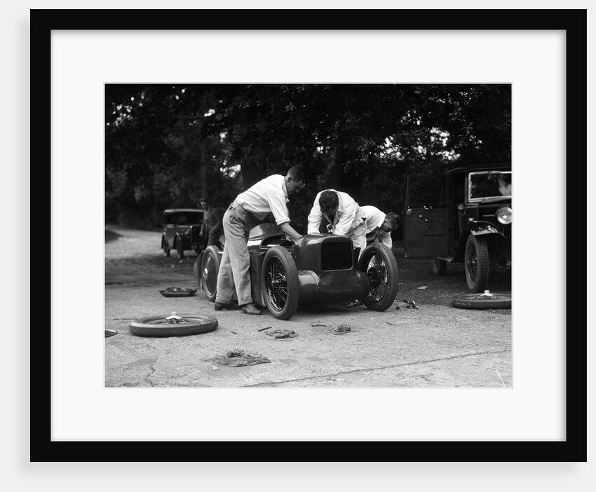 Mechanics working on Leon Cushman's Austin 7 racer for a speed record attempt, Brooklands, 1931 by Bill Brunell