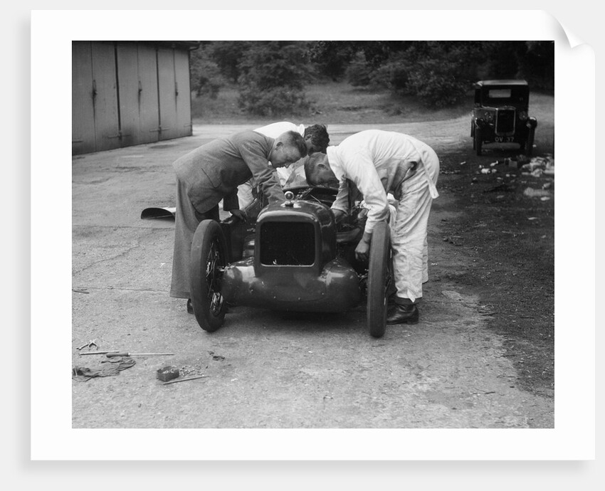 Mechanics working on Leon Cushman's Austin 7 racer for a speed record attempt, Brooklands, 1931 by Bill Brunell