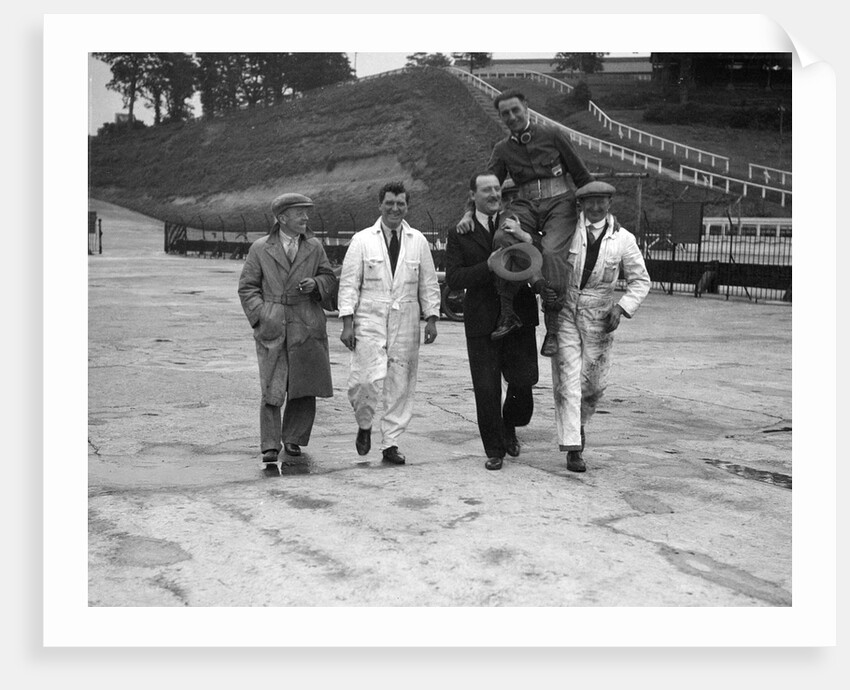 Leon Cushman being carried aloft after making a successful speed record attempt, Brooklands, 1931 by Bill Brunell