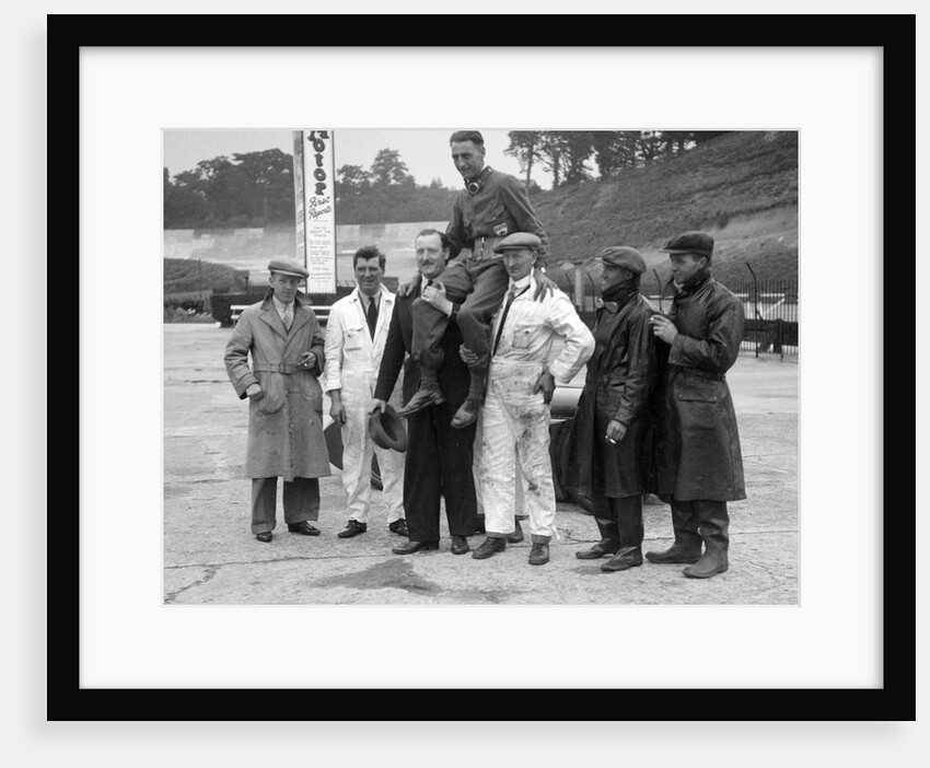 Leon Cushman being carried aloft after making a successful speed record attempt, Brooklands, 1931 by Bill Brunell
