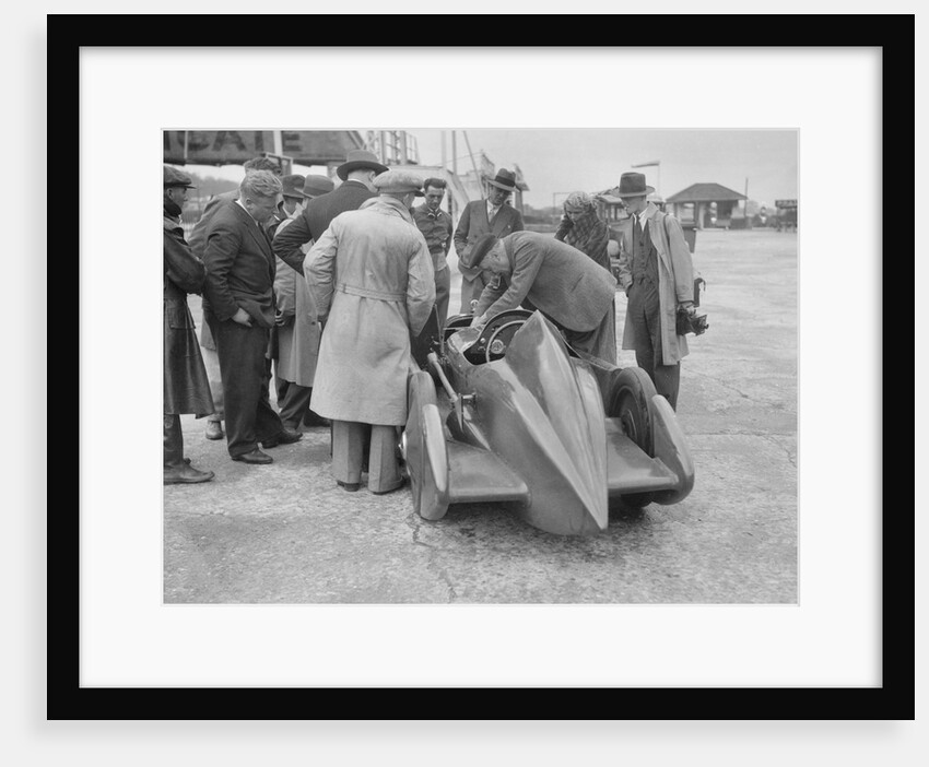 People examining Leon Cushman's Austin 7 racer at Brooklands for a speed record attempt, 1931 by Bill Brunell