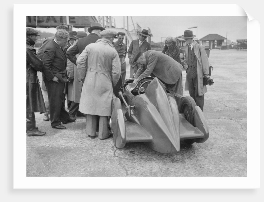 People examining Leon Cushman's Austin 7 racer at Brooklands for a speed record attempt, 1931 by Bill Brunell