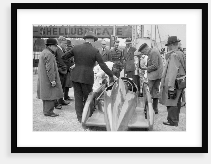 People examining Leon Cushman's Austin 7 racer at Brooklands for a speed record attempt, 1931 by Bill Brunell