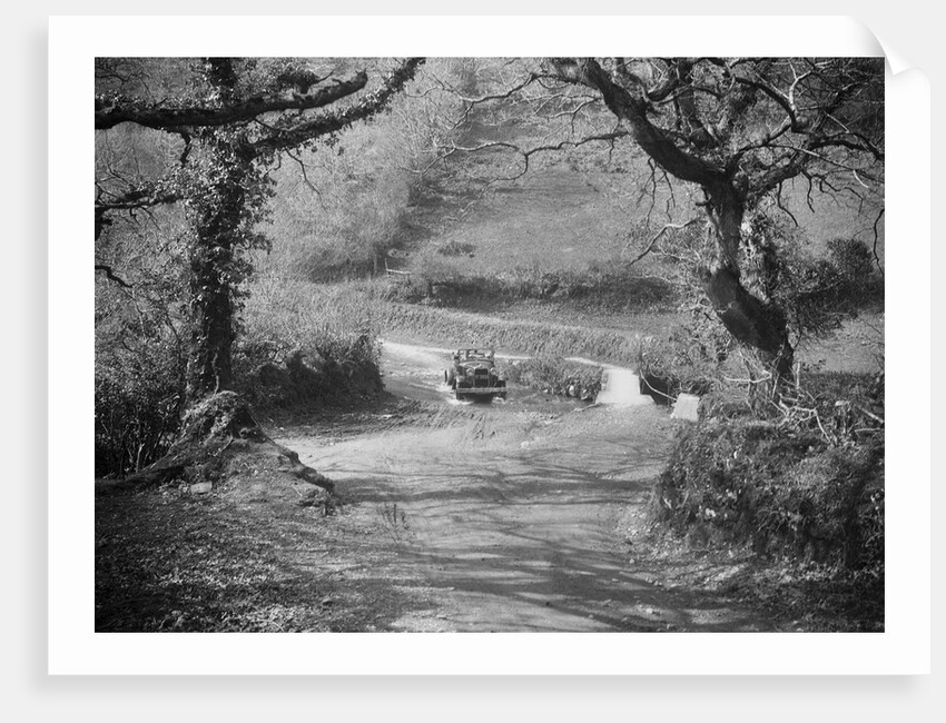 Kitty Brunell driving a 1930 Ford Model A 2-seater through a ford, 1931 by Bill Brunell