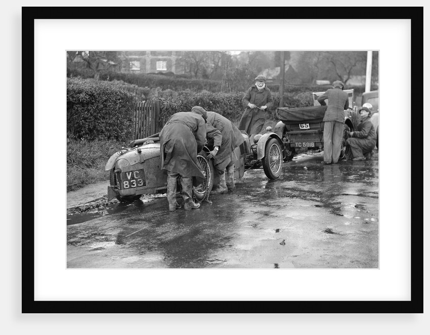 Attaching snow chains to JE Lancaster's Riley Brooklands during the Inter-Varsity Trial, 1930 by Bill Brunell