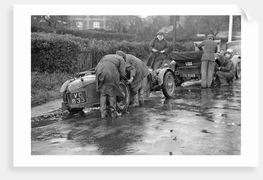 Attaching snow chains to JE Lancaster's Riley Brooklands during the Inter-Varsity Trial, 1930 by Bill Brunell