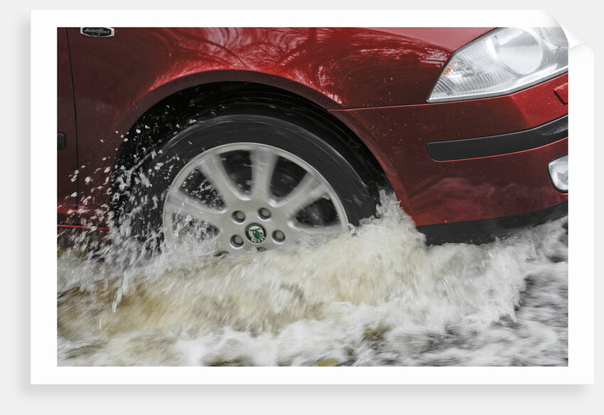Car driving through flood by Unknown