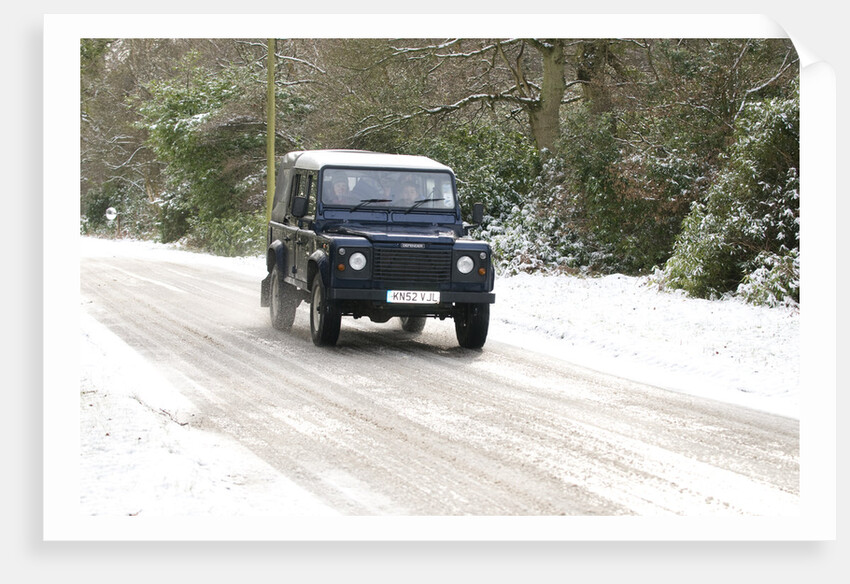 2002 Land Rover Defender driving on snowy road, 2009 by Unknown