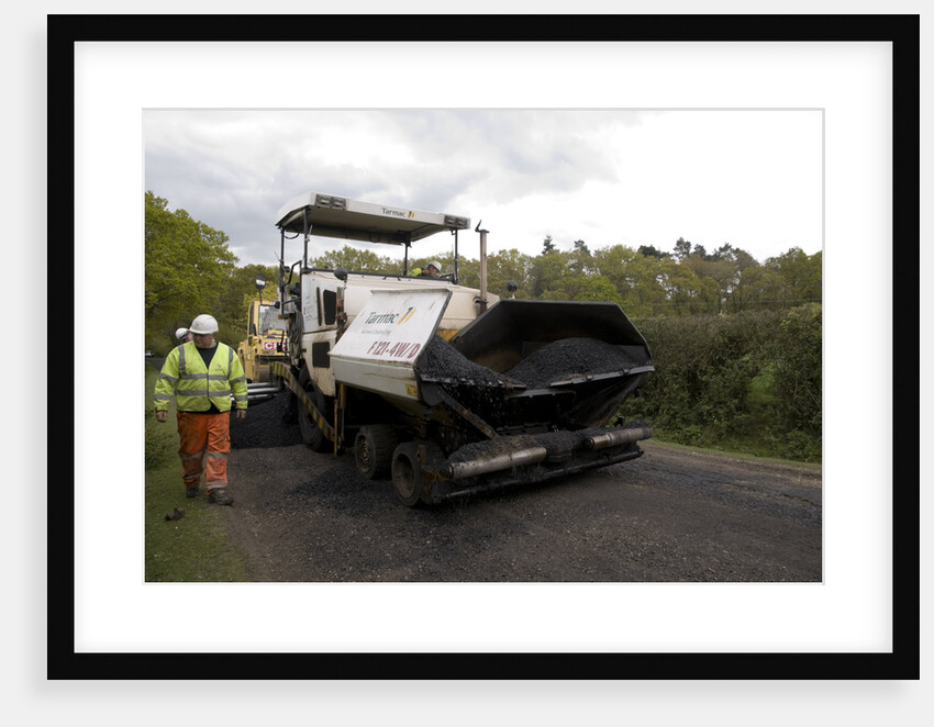 Road resurfacing work repairing potholes by Unknown