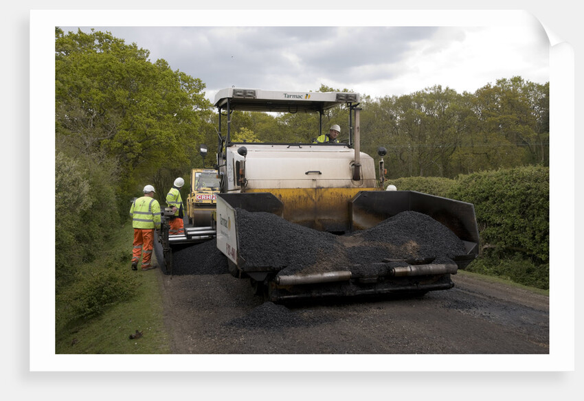 Road resurfacing work repairing potholes by Unknown