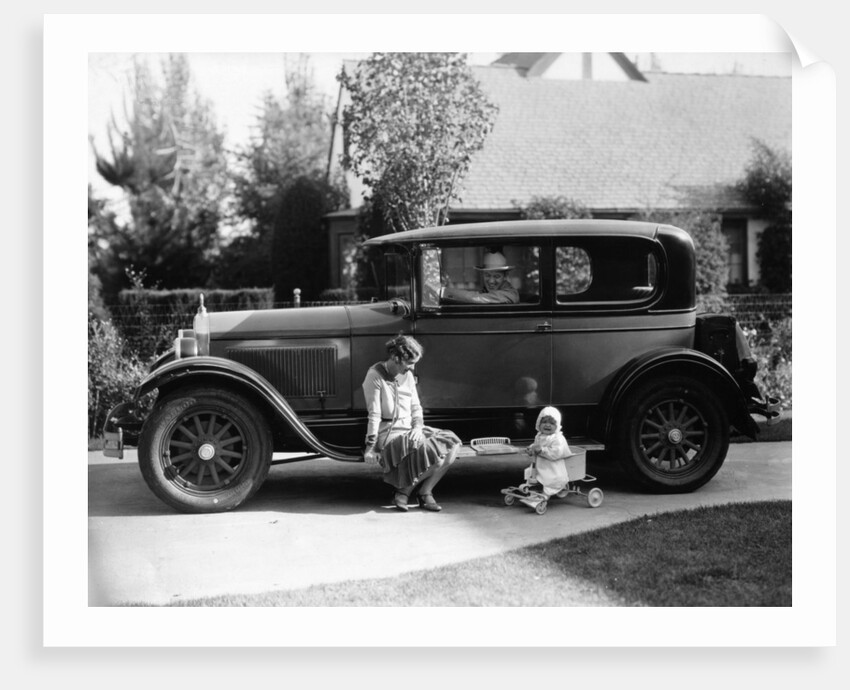 Stan Laurel at the wheel of 1927 Hupmobile with his wife Lois and daughter Lois by Unknown